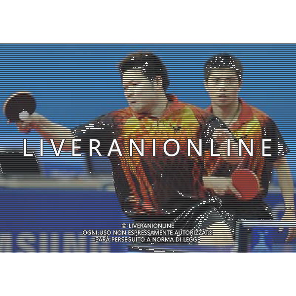 (101116) -- GUANGZHOU, Nov. 16, 2010 () -- Chinese Taipei\'s Chuang Chih Yuan/Wu Chih Chi (L) compete during the men\'s doubles 1/16 final of table tennis against Japan\'s Kishikawa Seiya/Mizutani Jun at the 16th Asian Games held in Guangzhou, capital of south China\'s Guangdong Province, Nov. 16, 2010. The pair of Chinese Taipei won by 3-2. (/Xu Jiajun) ©photoshot/Agenzia Aldo Liverani Sas - ITALY ONLY - 16a Giochi Asiatici di Guangzhou, nel sud della Cina