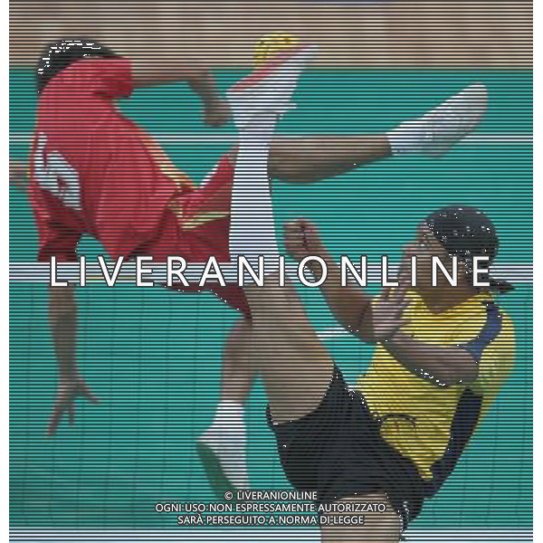 (101116) -- GUANGZHOU, Nov. 16, 2010 () -- Player of Malaysia(R) kicks the ball during the men\'s team preliminary match group B of the Sepaktakraw event against the team of China at the 16th Asian Games held in Guangzhou, capital of south China\'s Guangdong Province, Nov. 16, 2010. The team of Malaysia won by 2-1. (/Li Ming) (sss) ©photoshot/Agenzia Aldo Liverani Sas - ITALY ONLY - 16a Giochi Asiatici di Guangzhou, nel sud della Cina