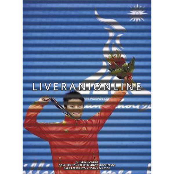 (101116) -- GUANGZHOU, Nov. 16, 2010 () -- Wu Yanan of China poses on the podium during the awarding ceremony for the men\'s Taijiquan\Taijijian All-Round event of Wushu at the 16th Asian Games in Guangzhou, capital of south China\'s Guangdong Province, Nov. 16, 2010. Wu Yanan won the gold medal by 19.80 points. (/Gesang Dawa) (sss) ©photoshot/Agenzia Aldo Liverani Sas - ITALY ONLY - 16a Giochi Asiatici di Guangzhou, nel sud della Cina