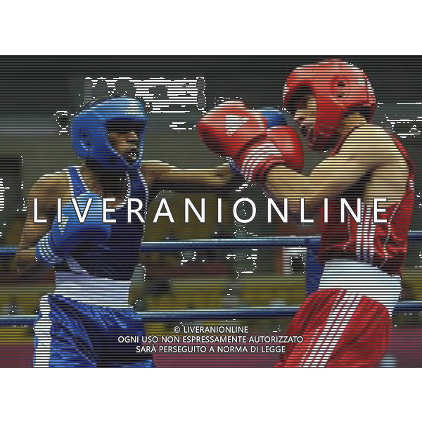 (101116) -- GUANGZHOU, Nov. 16, 2010 () -- Sultan Mohammed A Almuntashiri (L) of Saudi Arabia punches Mohammad Alwadi of Jordan during the men\'s boxing 52kg match at the 16th Asian Games in Guangzhou, south China\'s Guangdong Province, Nov. 16, 2010. Almuntashiri lost the match 2-10. (/Gong Lei) ©photoshot/Agenzia Aldo Liverani Sas - ITALY ONLY - 16a Giochi Asiatici di Guangzhou, nel sud della Cina