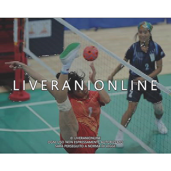 (101117) -- GUANGZHOU, Nov. 17() -- Sun Xiaodan(L) of China kicks the ball during a preliminary match of women\'s team sepaktakraw competition against India at the 16th Asian Games in Guangzhou, south China\'s Guangdong Province, Nov. 17, 2010. China won the match 3-0. (/Guo Yong) ©PHOTOSHOT /Agenzia Aldo Liverani Sas - ITALY ONLY - CINA: 16mi Giochi Asiatici di Guangzhou