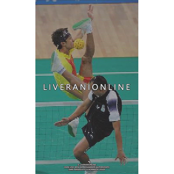 (101117) -- GUANGZHOU, Nov. 17() -- Xu Mingchi of China kicks the ball during a preliminary match of men\'s team sepaktakraw competition against India at the 16th Asian Games in Guangzhou, south China\'s Guangdong Province, Nov. 17, 2010. China won the match 2-1. (/Guo Yong) ©PHOTOSHOT /Agenzia Aldo Liverani Sas - ITALY ONLY - CINA: 16mi Giochi Asiatici di Guangzhou