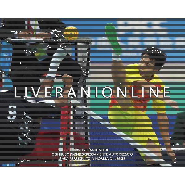 (101117) -- GUANGZHOU, Nov. 17() -- Zhou Haiyang (R) of China kicks the ball during a preliminary match of men\'s team sepaktakraw competition against India at the 16th Asian Games in Guangzhou, south China\'s Guangdong Province, Nov. 17, 2010. China won the match 2-1. (/Guo Yong) ©PHOTOSHOT /Agenzia Aldo Liverani Sas - ITALY ONLY - CINA: 16mi Giochi Asiatici di Guangzhou