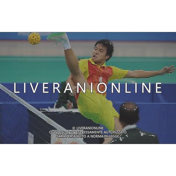 (101117) -- GUANGZHOU, Nov. 17() -- Zhou Haiyang of China kicks the ball during a preliminary match of men\'s team sepaktakraw competition against India at the 16th Asian Games in Guangzhou, south China\'s Guangdong Province, Nov. 17, 2010. China won the match 2-1. (/Guo Yong) ©PHOTOSHOT /Agenzia Aldo Liverani Sas - ITALY ONLY - CINA: 16mi Giochi Asiatici di Guangzhou