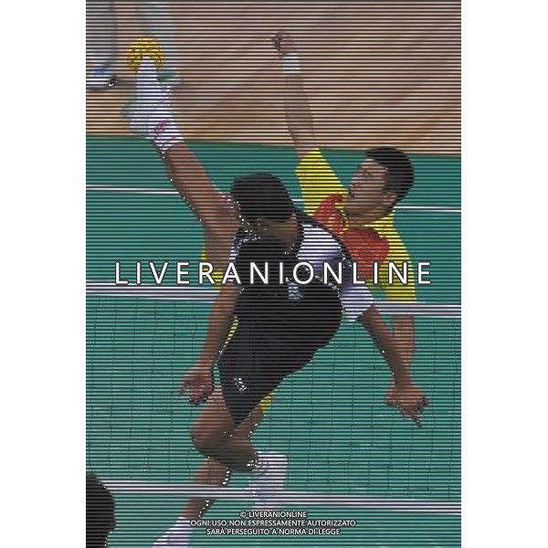 (101117) -- GUANGZHOU, Nov. 17() -- Wang Jian of China kicks the ball during a preliminary match of men\'s team sepaktakraw competition against India at the 16th Asian Games in Guangzhou, south China\'s Guangdong Province, Nov. 17, 2010. China won the match 2-1. (/Li Yong) ©PHOTOSHOT /Agenzia Aldo Liverani Sas - ITALY ONLY - CINA: 16mi Giochi Asiatici di Guangzhou