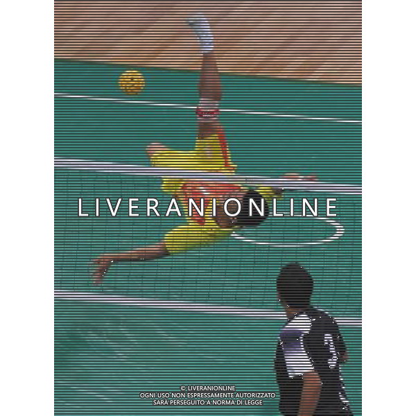 (101117) -- GUANGZHOU, Nov. 17() -- Wang Jian (top) of China kicks the ball during a preliminary match of men\'s team sepaktakraw competition against India at the 16th Asian Games in Guangzhou, south China\'s Guangdong Province, Nov. 17, 2010. China won the match 2-1. (/Li Yong) ©PHOTOSHOT /Agenzia Aldo Liverani Sas - ITALY ONLY - CINA: 16mi Giochi Asiatici di Guangzhou
