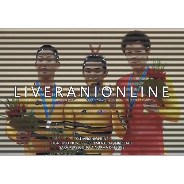 (101117) -- GUANGZHOU, Nov. 17 () -- Gold medalist Azizulhasni Awang (C) of Malaysia, silver medalist Josiah Ng (L) of Malaysia and bronze medalist Zhang Miao of China pose on the podium during the awarding ceremony for the men\'s Keirin final of Cycling Track competition at the 16th Asian Games in Guangzhou, south China\'s Guangdong Province, Nov. 17, 2010. (/Li Ga) ©PHOTOSHOT /Agenzia Aldo Liverani Sas - ITALY ONLY - CINA: 16mi Giochi Asiatici di Guangzhou