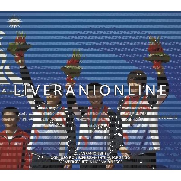 (101117) -- GUANGZHOU, Nov. 17() -- Team South Korea celebrate on the podium during the awarding ceremony for the men\'s 10m Running Target Mixed Team at the 16th Asian Games in Guangzhou, south China\'s Guangdong Province, Nov. 17, 2010. South Korea took the bronze with 1121 points. (/Chen Yehua) ©PHOTOSHOT /Agenzia Aldo Liverani Sas - ITALY ONLY - CINA: 16mi Giochi Asiatici di Guangzhou