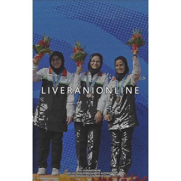 (101117) -- GUANGZHOU, Nov. 17() -- Bronze medalists Team Iran pose on the podium during the awarding ceremony for the women\'s 50m Rifle 3 Positions team at the 16th Asian Games in Guangzhou, south China\'s Guangdong Province, Nov. 17, 2010. Iran took the bronze with 1719 points. (/Chen Yehua) ©PHOTOSHOT /Agenzia Aldo Liverani Sas - ITALY ONLY - CINA: 16mi Giochi Asiatici di Guangzhou