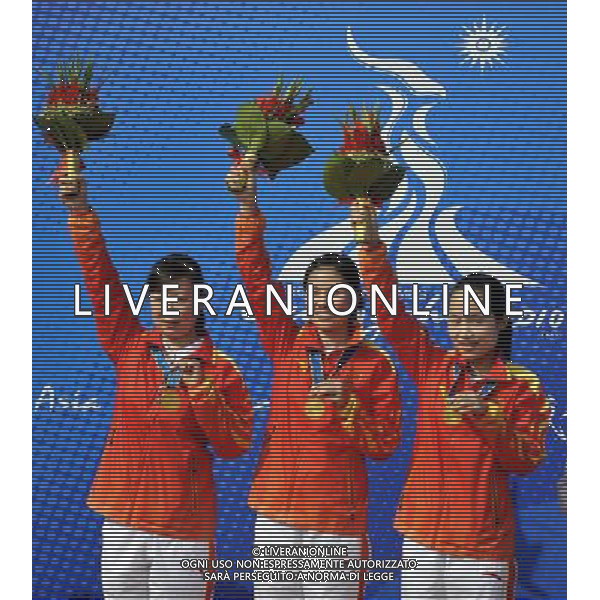 (101117) -- GUANGZHOU, Nov. 17() -- Gold medalists Team China pose on the podium during the awarding ceremony for the women\'s 50m Rifle 3 Positions team at the 16th Asian Games in Guangzhou, south China\'s Guangdong Province, Nov. 17, 2010. China took the gold with 1733 points. (/Chen Yehua) ©PHOTOSHOT /Agenzia Aldo Liverani Sas - ITALY ONLY - CINA: 16mi Giochi Asiatici di Guangzhou