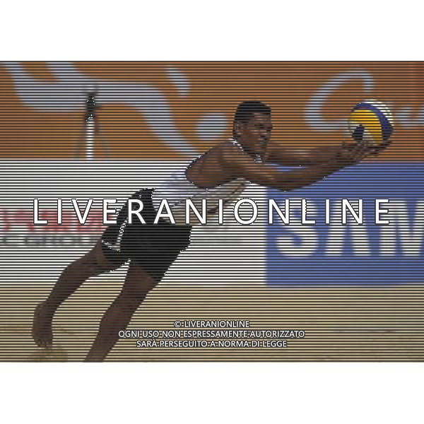 (101117) -- GUANGZHOU, Nov. 17, 2010 () -- Soares of Timor-Leste saves the ball in the men\'s preliminary match against China\'s Gao Peng/Li Jian of the Beach Volleyball event at the 16th Asian Games in Guangzhou, south China\'s Guangdong Province, Nov. 17, 2010. Soares(R)/Xavier lost 0-2. (/Yang Lei)(sss) ©PHOTOSHOT /Agenzia Aldo Liverani Sas - ITALY ONLY - CINA: 16mi Giochi Asiatici di Guangzhou