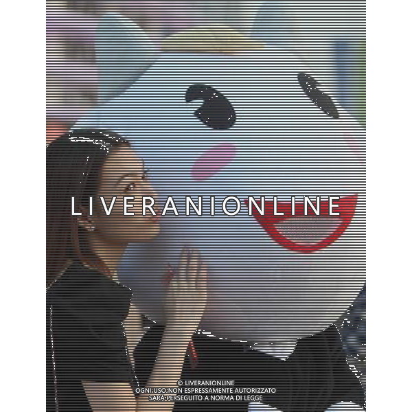 A woman kisses the Le Yangyang, mascot of the Guangzhou Asian Games, at the Haixinsha Square in Guangzhou in south China\'s Guangdong province on Friday, Nov. 12, 2010.(Photo By Tang Yanjun/ColorChinaPhoto) - AG. ALDO LIVERANI SAS ITALY ONLY CINA - GIOCHI ASIATICI DI GUANGZHOU 2010