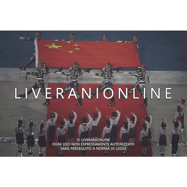 Chinese honor guard escort the national flag during the Asian Games opening ceremony on the Haixinsha Island in Guangzhou in south China\'s Guangdong province on Friday, Nov. 12, 2010.(Photo By Sheng Jiapeng/ColorChinaPhoto) - AG. ALDO LIVERANI SAS ITALY ONLY CINA - GIOCHI ASIATICI DI GUANGZHOU 2010