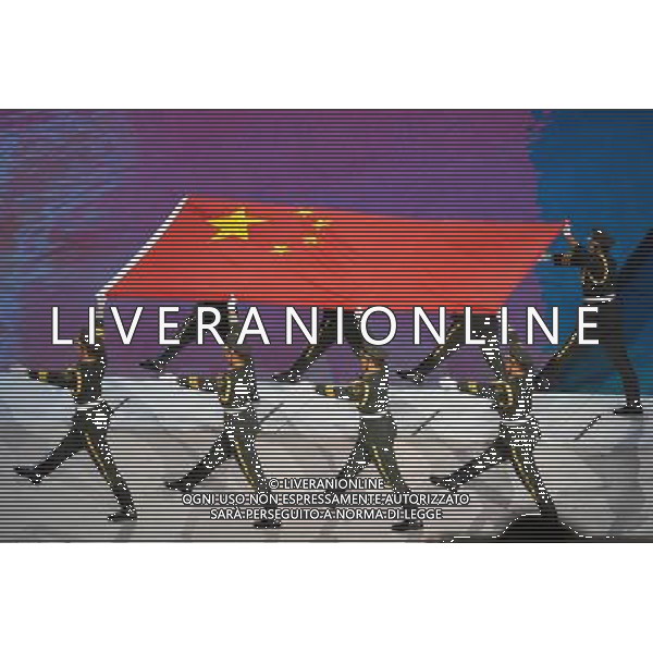 Chinese honor guard escort the national flag during the Asian Games opening ceremony on the Haixinsha Island in Guangzhou in south China\'s Guangdong province on Friday, Nov. 12, 2010.(Photo By Li Huang/ColorChinaPhoto) - AG. ALDO LIVERANI SAS ITALY ONLY CINA - GIOCHI ASIATICI DI GUANGZHOU 2010