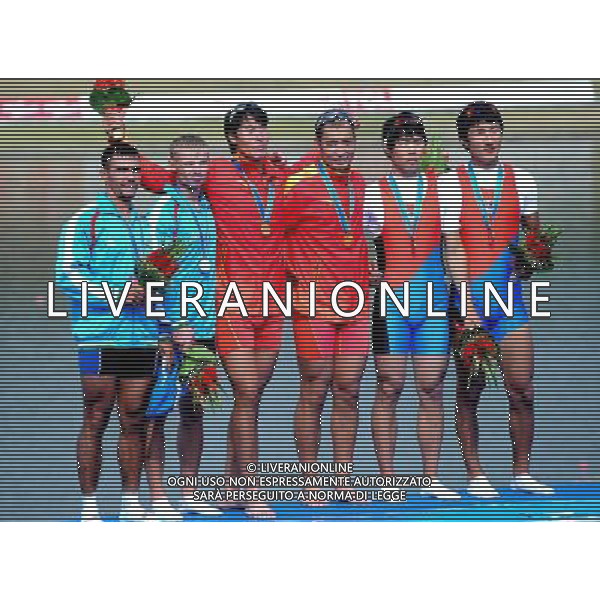 (101118) -- GUANGZHOU, Nov. 18, 2010 () -- Gold medalists Su Hui (3rd R)/Zhang Liang (3rd L) of China, silver medalists Ruslan Naurzaliev (1st L)/Vyacheslav Didrih (2nd L) of Uzbekistan and bronze medalists Kim Dongyong (1st R)/Kim Hwiqwan of South Korea pose on the podium during the awarding ceremony for the men\'s Double Sculls of rowing event at the 16th Asian Games in Guangzhou, south China\'s Guangdong Province, Nov. 18, 2010. (/Wu Xiaoling) ©photoshot/Agenzia Aldo Liverani Sas - ITALY ONLY - CINA: 16mi Giochi Asiatici di Guangzhou