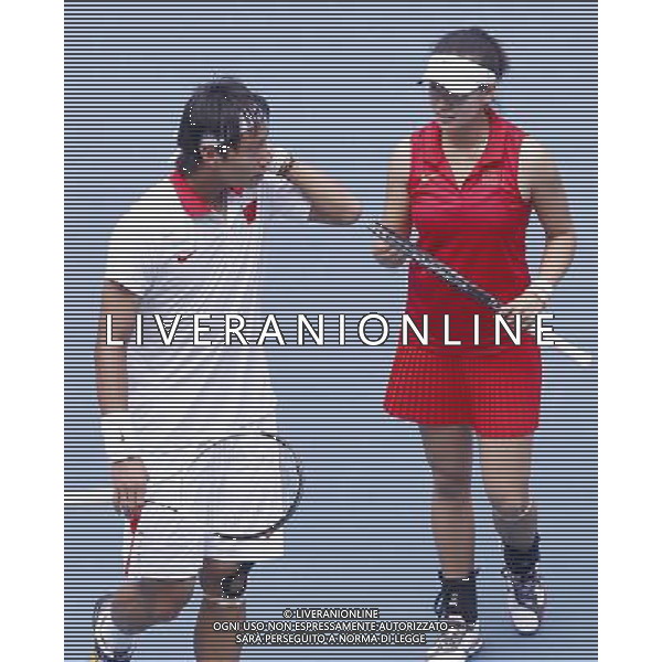 (101118) -- GUANGZHOU, Nov. 18, 2010 () -- Bai Yan(L) of China communicates with his partner Sun Shengnan during their first round match of mixed doubles of tennis against Huynh Phuong Dai Trang/ Le Quoc Khanh of Viet Nam at the 16th Asian Games in Guangzhou, south China\'s Guangdong Province, Nov. 18, 2010. Bai and Sun won 2-0. (/Chen Jianli)(wll) ©photoshot/Agenzia Aldo Liverani Sas - ITALY ONLY - CINA: 16mi Giochi Asiatici di Guangzhou