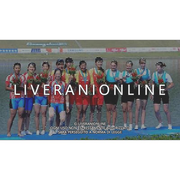 (101118) -- GUANGZHOU, Nov. 18, 2010 () -- Medalists take a group photo on the podium during the awarding ceremony for the women\'s four final Race A of rowing event at the 16th Asian Games in Guangzhou, south China\'s Guangdong Province, Nov. 18, 2010. The team of China(C) claimed the title of the event. South Korea(L) and Kazakhstan took the silver and bronze respectively. (/Wu Xiaoling)(wll) ©photoshot/Agenzia Aldo Liverani Sas - ITALY ONLY - CINA: 16mi Giochi Asiatici di Guangzhou
