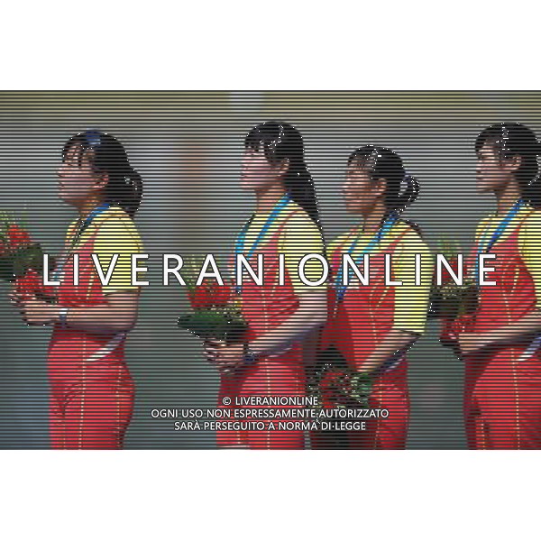 (101118) -- GUANGZHOU, Nov. 18, 2010 () -- Ding Yanjie, Liu Jiahuan, Li Xin and Ji Zhen (from L to R) of China react on the podium during the awarding ceremony for the women\'s four final Race A of rowing event at the 16th Asian Games in Guangzhou, south China\'s Guangdong Province, Nov. 18, 2010. China claimed the title of the event. (/Wu Xiaoling)(wll) ©photoshot/Agenzia Aldo Liverani Sas - ITALY ONLY - CINA: 16mi Giochi Asiatici di Guangzhou