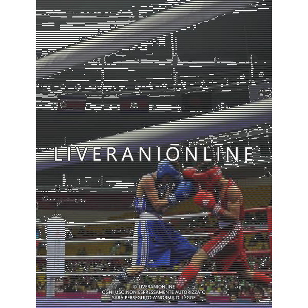 (101118) -- FOSHAN, Nov. 18, 2010 () -- Lin Yu Che (L) of Chinese Taipei vies with Nguyen van Hai of Vietnam during the men\'s boxing 52kg 1/8 final match at the 16th Asian Games in Foshan, south China\'s Guangdong Province, Nov. 18, 2010. Lin won the match 5-3. ©photoshot/Agenzia Aldo Liverani Sas - ITALY ONLY - CINA: 16mi Giochi Asiatici di Guangzhou