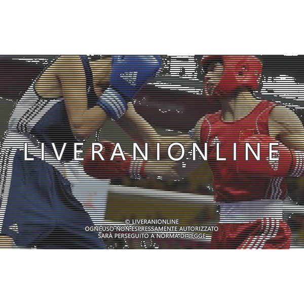 (101118) -- FOSHAN, Nov. 18, 2010 () -- Chang Yong (R) of China vies with Farah Yomudov of Turkmenistan during the men\'s boxing 52kg 1/8 final match at the 16th Asian Games in Foshan, south China\'s Guangdong Province, Nov. 18, 2010. Chang won the match 14-0. ©photoshot/Agenzia Aldo Liverani Sas - ITALY ONLY - CINA: 16mi Giochi Asiatici di Guangzhou