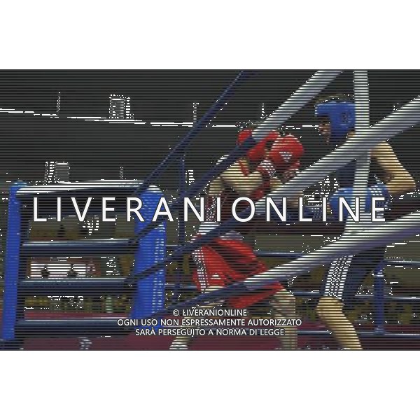 (101118) -- FOSHAN, Nov. 18, 2010 () -- Chang Yong (L) of China vies with Farah Yomudov of Turkmenistan during the men\'s boxing 52kg 1/8 final match at the 16th Asian Games in Foshan, south China\'s Guangdong Province, Nov. 18, 2010. Chang won the match 14-0. ©photoshot/Agenzia Aldo Liverani Sas - ITALY ONLY - CINA: 16mi Giochi Asiatici di Guangzhou