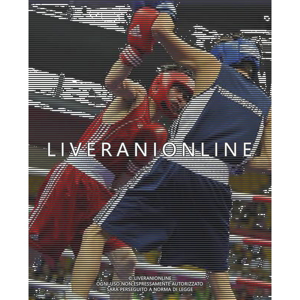 (101118) -- FOSHAN, Nov. 18, 2010 () -- Chang Yong (L) of China vies with Farah Yomudov of Turkmenistan during the men\'s boxing 52kg 1/8 final match at the 16th Asian Games in Foshan, south China\'s Guangdong Province, Nov. 18, 2010. Chang won the match 14-0. (/Gong Lei) ©photoshot/Agenzia Aldo Liverani Sas - ITALY ONLY - CINA: 16mi Giochi Asiatici di Guangzhou
