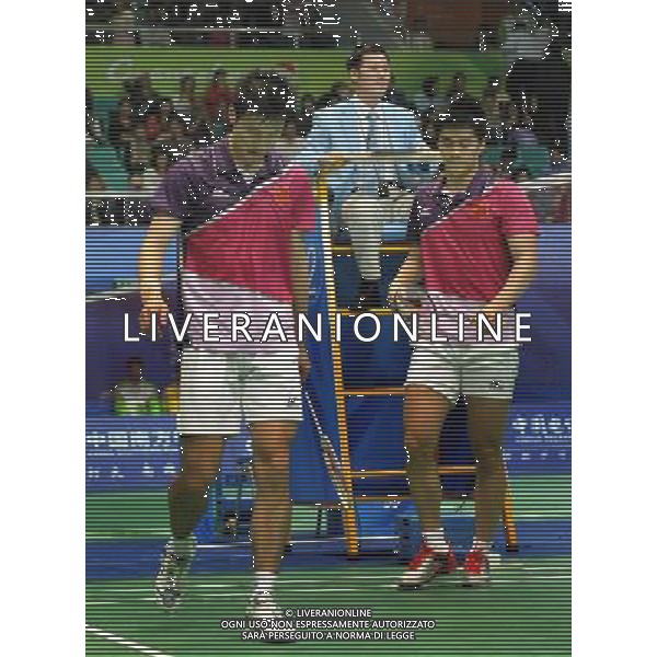 (101118) -- GUANGZHOU, Nov. 18, 2010 () -- China\'s Cai Yun (L)/Fu Haifeng react after losing to South Korea\'s Chung Jae Sung/Lee Yong Dae during men\'s double quarter-final of badminton at the 16th Asian Games in Guangzhou, south China\'s Guangdong Province, Nov. 18, 2010. Cai Yun/Fu Haifeng lost the match 0-2. (/Lu Hanxin) ©photoshot/Agenzia Aldo Liverani Sas - ITALY ONLY - CINA: 16mi Giochi Asiatici di Guangzhou