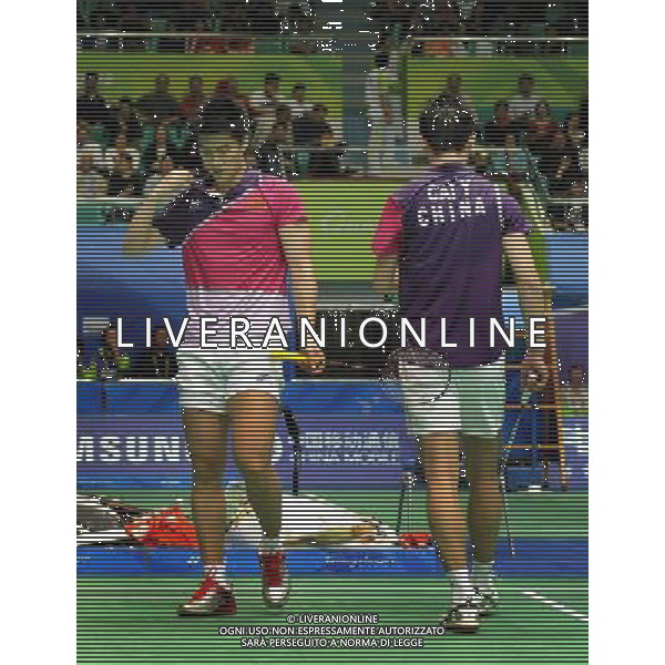 (101118) -- GUANGZHOU, Nov. 18, 2010 () -- China\'s Cai Yun (R)/Fu Haifeng react during men\'s double quarter-final of badminton against South Korea\'s Chung Jae Sung/Lee Yong Dae at the 16th Asian Games in Guangzhou, south China\'s Guangdong Province, Nov. 18, 2010. Cai Yun/Fu Haifeng lost the match 0-2. (/Lu Hanxin) ©photoshot/Agenzia Aldo Liverani Sas - ITALY ONLY - CINA: 16mi Giochi Asiatici di Guangzhou