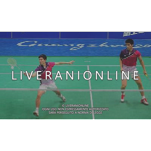 (101118) -- GUANGZHOU, Nov. 18, 2010 () -- China\'s Cai Yun (L)/Fu Haifeng compete against South Korea\'s Chung Jae Sung/Lee Yong Dae during men\'s double quarter-final of badminton at the 16th Asian Games in Guangzhou, south China\'s Guangdong Province, Nov. 18, 2010. Cai Yun/Fu Haifeng lost the match 0-2. (/Lu Hanxin) ©photoshot/Agenzia Aldo Liverani Sas - ITALY ONLY - CINA: 16mi Giochi Asiatici di Guangzhou