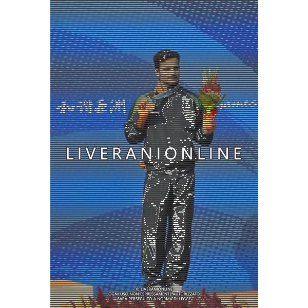 (101118) -- GUANGZHOU, Nov. 18, 2010 () -- Bronze medalist India\'s Vijay Kumar poses during the awarding ceremony for the men\'s 25m center fire pistol event of shooting at the 16th Asian Games in Guangzhou, south China\'s Guangdong Province, Nov. 18, 2010. (/Chen Yehua) ©photoshot/Agenzia Aldo Liverani Sas - ITALY ONLY - CINA: 16mi Giochi Asiatici di Guangzhou