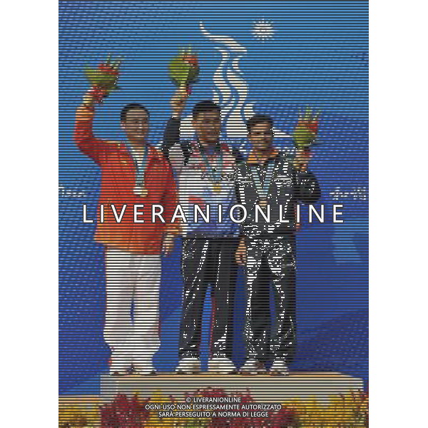 (101118) -- GUANGZHOU, Nov. 18, 2010 () -- Gold medalist South Korea\'s Park Byung Taek (C), silver medalist China\'s Liu Yadong (L) and bronze medalist India\'s Vijay Kumar pose during the awarding ceremony for the men\'s 25m center fire pistol event of shooting at the 16th Asian Games in Guangzhou, south China\'s Guangdong Province, Nov. 18, 2010. (/Chen Yehua) ©photoshot/Agenzia Aldo Liverani Sas - ITALY ONLY - CINA: 16mi Giochi Asiatici di Guangzhou