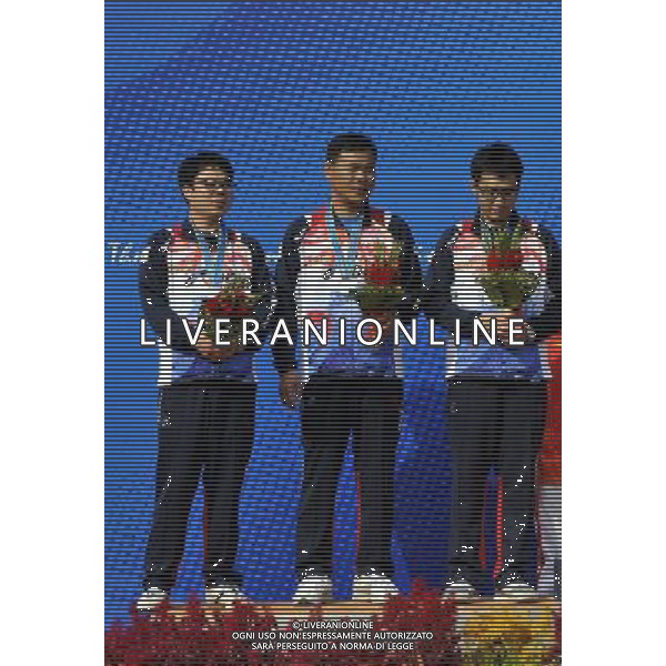 (101118) -- GUANGZHOU, Nov. 18, 2010 () -- (From L to R) Silver medalists Jang Daekyu, Park Byung Taek and Hong Seonghwan of South Korea pose during the awarding ceremony for the men\'s 25m center fire pistol team event of shooting at the 16th Asian Games in Guangzhou, south China\'s Guangdong Province, Nov. 18, 2010. (/Chen Yehua) ©photoshot/Agenzia Aldo Liverani Sas - ITALY ONLY - CINA: 16mi Giochi Asiatici di Guangzhou