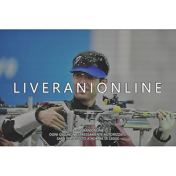 (101118) -- GUANGZHOU, Nov. 18() -- Bronze medalist Zhu Qinan of China reacts during the men\'s 50m Rifle 3 Positions match at the 16th Asian Games in Guangzhou, south China\'s Guangdong Province, Nov. 18, 2010. (/Chen Yehua) ©photoshot/Agenzia Aldo Liverani Sas - ITALY ONLY - CINA: 16mi Giochi Asiatici di Guangzhou