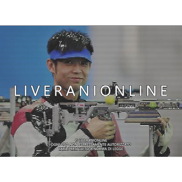 (101118) -- GUANGZHOU, Nov. 18() -- Bronze medalist Zhu Qinan of China reacts during the men\'s 50m Rifle 3 Positions match at the 16th Asian Games in Guangzhou, south China\'s Guangdong Province, Nov. 18, 2010. (/Chen Yehua) ©photoshot/Agenzia Aldo Liverani Sas - ITALY ONLY - CINA: 16mi Giochi Asiatici di Guangzhou