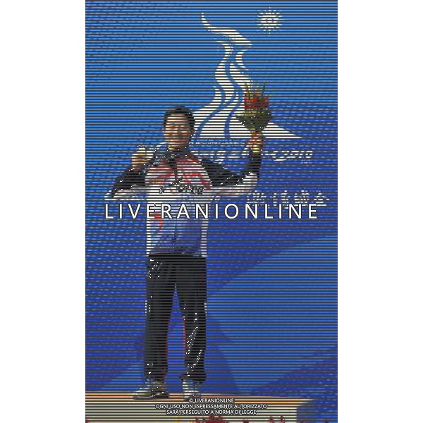 (101118) -- GUANGZHOU, Nov. 18() -- Gold medalist Han Jinweop of South Korea poses on the podium during the awarding ceremony for the men\'s 50m Rifle 3 Positions match at the 16th Asian Games in Guangzhou, south China\'s Guangdong Province, Nov. 18, 2010. (/Chen Yehua) ©photoshot/Agenzia Aldo Liverani Sas - ITALY ONLY - CINA: 16mi Giochi Asiatici di Guangzhou