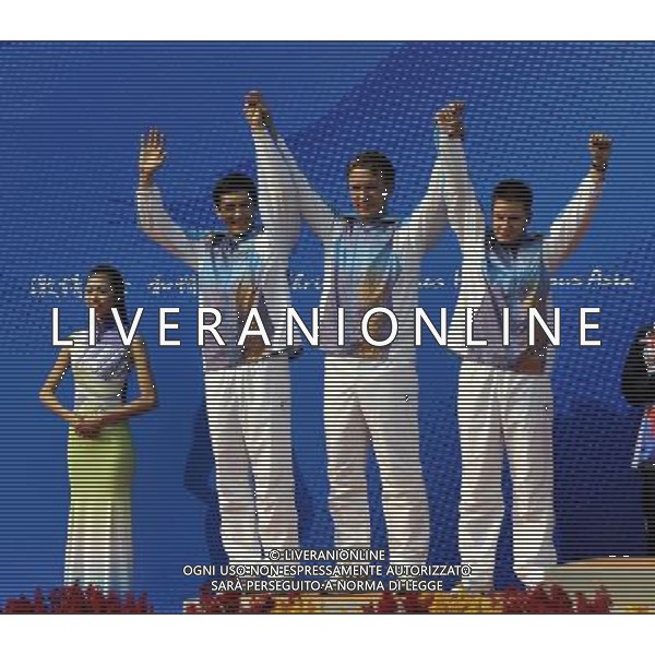 (101118) -- GUANGZHOU, Nov. 18() -- Silver medalists Igor Pirekeyev, Vitaliy Dovgun, Yuriy Yurkov (left to right) of Kazakstan pose on the podium during the awarding ceremony for the men\'s 50m Rifle 3 Positions Team Match at the 16th Asian Games in Guangzhou, south China\'s Guangdong Province, Nov. 18, 2010. Kazakstan won the silver medal with total score of 3478 points.(/Chen Yehua) ©photoshot/Agenzia Aldo Liverani Sas - ITALY ONLY - CINA: 16mi Giochi Asiatici di Guangzhou