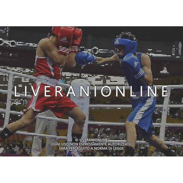 (101118) -- FOSHAN, Nov. 18, 2010 () -- Leong Son Keong (R) of Macao of China competes during the men\'s boxing 52kg 1/8 final match against Katsuaki Susa of Japan at the 16th Asian Games in Guangzhou, south China\'s Guangdong Province, Nov. 18, 2010. Leong lost the match 0-17. (/Gong Lei) ©photoshot/Agenzia Aldo Liverani Sas - ITALY ONLY - CINA: 16mi Giochi Asiatici di Guangzhou
