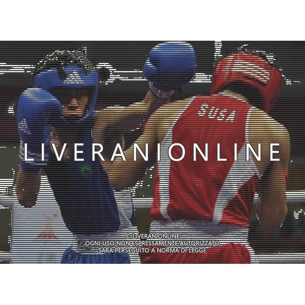 (101118) -- FOSHAN, Nov. 18, 2010 () -- Leong Son Keong (L) of Macao of China competes during the men\'s boxing 52kg 1/8 final match against Katsuaki Susa of Japan at the 16th Asian Games in Guangzhou, south China\'s Guangdong Province, Nov. 18, 2010. Leong lost the match 0-17. (/Gong Lei) ©photoshot/Agenzia Aldo Liverani Sas - ITALY ONLY - CINA: 16mi Giochi Asiatici di Guangzhou