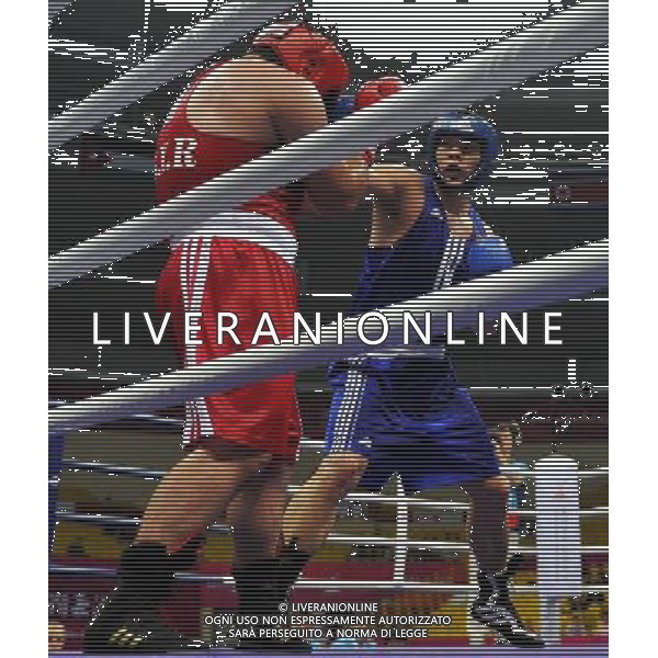 (101118) -- FOSHAN, Nov. 18, 2010 () -- Zhang Zhilei (R) of China competes during the men\'s boxing +91kg quarterfinal match against Soumar Ghossoun of Syria at the 16th Asian Games in Foshan, south China\'s Guangdong Province, Nov. 18, 2010. Zhang won the match 5-3. (/Gong Lei) ©photoshot/Agenzia Aldo Liverani Sas - ITALY ONLY - CINA: 16mi Giochi Asiatici di Guangzhou