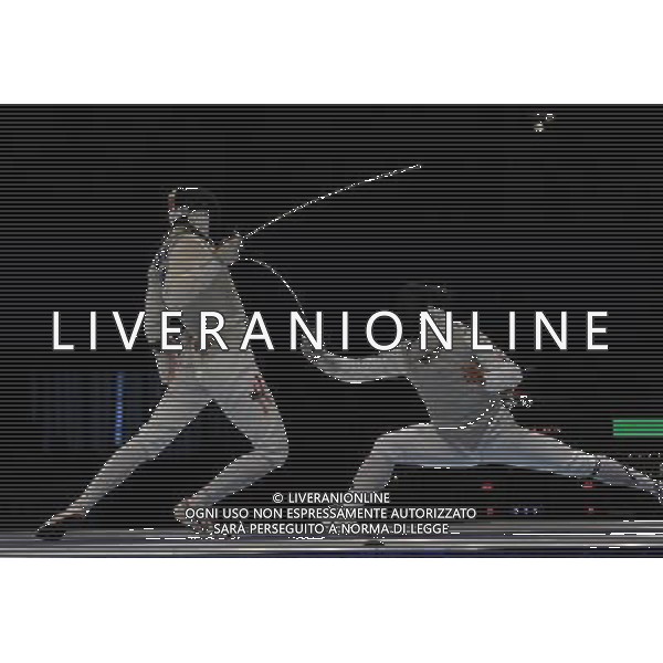 (101120) -- GUANGZHOU, Nov. 20, 2010 () -- South Korea\'s Choi Byung Chul (R) competes with Cheung Siu Lun of Hong Kong of China during the men\'s individual foil final of fencing at the 16th Asian Games in Guangzhou, south China\'s Guangdong Province, Nov. 20, 2010. Choi Byung Chul won the match 15-14 to claim the title of the event. (/Yang Lei) ©photoshot/Agenzia Aldo Liverani Sas - ITALY ONLY - CINA: 16mi Giochi Asiatici