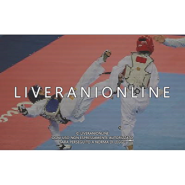 (101120) -- GUANGZHOU, Nov. 20, 2010 () -- John Paul Lizardo(L) of Philippines fights against Kim Seong Ho of South Korea during the semifinal of men\'s under 54kg of taekwondo at the 16th Asian Games in Guangzhou, south China\'s Guangdong Province, Nov. 20, 2010. Lizardo lost to Kim with 7-10 and took the bronze. (/Guo Dayue)(wll) ©photoshot/Agenzia Aldo Liverani Sas - ITALY ONLY - CINA: 16mi Giochi Asiatici
