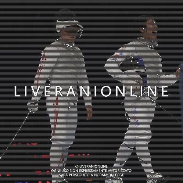 (101120) -- GUANGZHOU, Nov. 20, 2010 () -- South Korea\'s Choi Byung Chui(R) celebrates his victory in the men\'s individual foil semifinal match of Fencing against Japan\'s Ota Yuki at the 16th Asian Games in Guangzhou, south China\'s Guangdong Province, Nov. 20, 2010. Choi Byung Chui won 15-12 to entered the final of the event. (/Yang Lei) ©photoshot/Agenzia Aldo Liverani Sas - ITALY ONLY - CINA: 16mi Giochi Asiatici