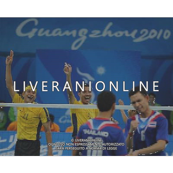 (101120) -- GUANGZHOU, Nov. 20, 2010 () -- Norshahruddin Mad Ghani (1st L) of Malaysia celebrates with teammate for the scoring during the Sepaktakraw men\'s team final against Thailand at the 16th Asian Games in Guangzhou, south China\'s Guangdong Province, Nov. 20, 2010. Malaysia lost the final by 0-2 and get the silver medal. (/Yan Yan) ©photoshot/Agenzia Aldo Liverani Sas - ITALY ONLY - CINA: 16mi Giochi Asiatici