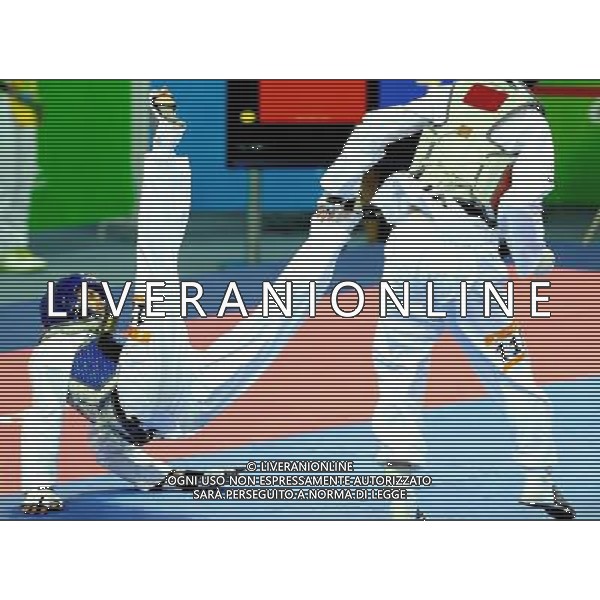 (101120) -- GUANGZHOU, Nov. 20, 2010 () -- John Paul Lizardo(L) of Philippines fights against Kim Seong Ho of South Korea during the semifinal of men\'s under 54kg of taekwondo at the 16th Asian Games in Guangzhou, south China\'s Guangdong Province, Nov. 20, 2010. Lizardo lost to Kim with 7-10 and took the bronze. (/Chen Kai)(wll) ©photoshot/Agenzia Aldo Liverani Sas - ITALY ONLY - CINA: 16mi Giochi Asiatici