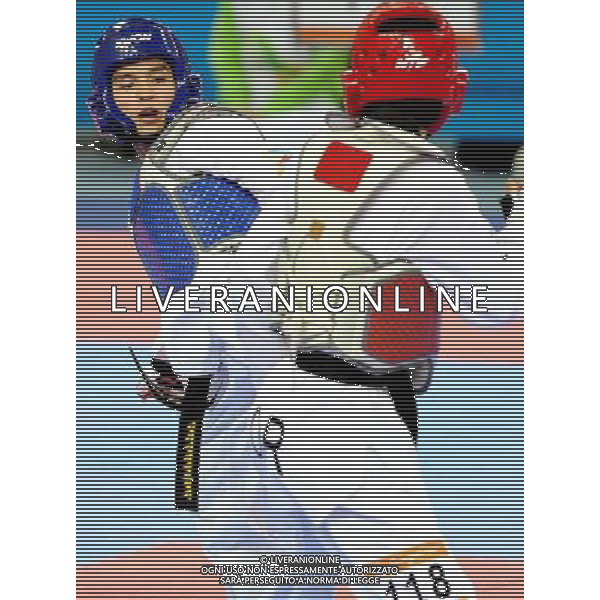 (101120) -- GUANGZHOU, Nov. 20, 2010 () -- John Paul Lizardo(L) of Philippines fights against Kim Seong Ho of South Korea during the semifinal of men\'s under 54kg of taekwondo at the 16th Asian Games in Guangzhou, south China\'s Guangdong Province, Nov. 20, 2010. Lizardo lost to Kim with 7-10 and took the bronze. (/Chen Kai)(wll) ©photoshot/Agenzia Aldo Liverani Sas - ITALY ONLY - CINA: 16mi Giochi Asiatici