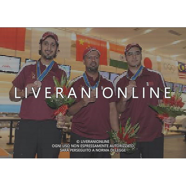 (101120) -- GUANGZHOU, Nov. 20, 2010 () -- Bronze medalists Mansour Al Hajri (L)/Mubarak Al Muraikhi (C)/Fahad Alemadi of Qatar pose during the awarding ceremony of the men\'s trios of bowling competition at the 16th Asian Games in Guangzhou, south China\'s Guangdong Province, Nov. 20, 2010. (/Li Gang) ©photoshot/Agenzia Aldo Liverani Sas - ITALY ONLY - CINA: 16mi Giochi Asiatici