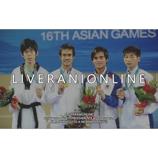 (101120) -- GUANGZHOU, Nov. 20, 2010 () -- Gold medalist Chutchawal Khawlaor(2nd L) of Thailand shows his medal with silver medalist Kim Seong Ho (1st L) of South Korea and bronze medalists John Paul Lizardo(2nd R) of Philippines and Hsu Chia Lin of Chinese Taipei during the awarding ceremony for men\'s under 54kg of taekwondo at the 16th Asian Games in Guangzhou, south China\'s Guangdong Province, Nov. 20, 2010. (/Chen Kai)(wll) ©photoshot/Agenzia Aldo Liverani Sas - ITALY ONLY - CINA: 16mi Giochi Asiatici