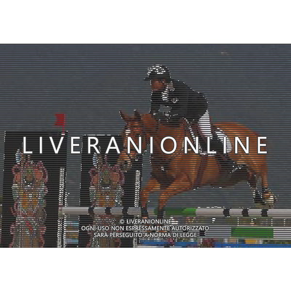 (101120) -- GUANGZHOU, Nov. 20, 2010 () -- South Korea\'s Song Sang Wuk competes with his horse Lutine De Brenil during the Eventing Team Qualifier Jumping of Equestrian competition at the 16th Asian Games in Guangzhou, south China\'s Guangdong Province, Nov. 20, 2010. South Korea got the fifth place of Eventing Team with 167.20 points in total result. (/Xiang Mei) ©photoshot/Agenzia Aldo Liverani Sas - ITALY ONLY - CINA: 16mi Giochi Asiatici