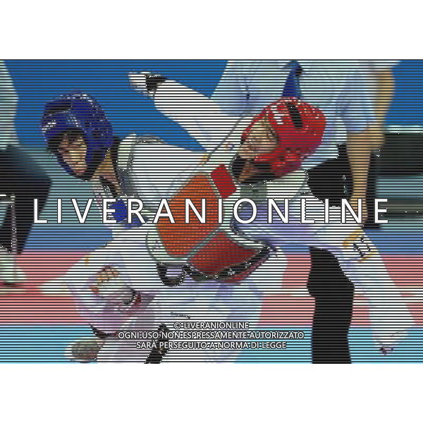 (101120) -- GUANGZHOU, Nov. 20, 2010 () -- Kim Seong Ho(L) of South Korea fights against Chutchawal Khawlaor of Thailand during the final of men\'s under 54kg of taekwondo at the 16th Asian Games in Guangzhou, south China\'s Guangdong Province, Nov. 20, 2010. Chutchawal Khawlaor claimed the title with 8-6. (/Chen Kai)(wll) ©photoshot/Agenzia Aldo Liverani Sas - ITALY ONLY - CINA: 16mi Giochi Asiatici