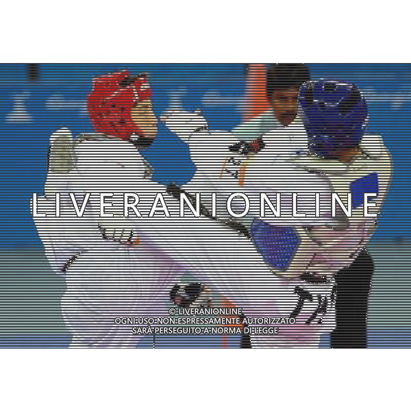 (101120) -- GUANGZHOU, Nov. 20, 2010 () -- Hsu Chia Lin(L) of Chinese Taipei fights against Chutchawal Khawlaor of Thailand during the semifinal of men\'s under 54kg of taekwondo at the 16th Asian Games in Guangzhou, south China\'s Guangdong Province, Nov. 20, 2010. Hsu Chia Lin lost to Chutchawal Khawlaor with 4-7 and took the bronze. (/Chen Kai)(wll) ©photoshot/Agenzia Aldo Liverani Sas - ITALY ONLY - CINA: 16mi Giochi Asiatici